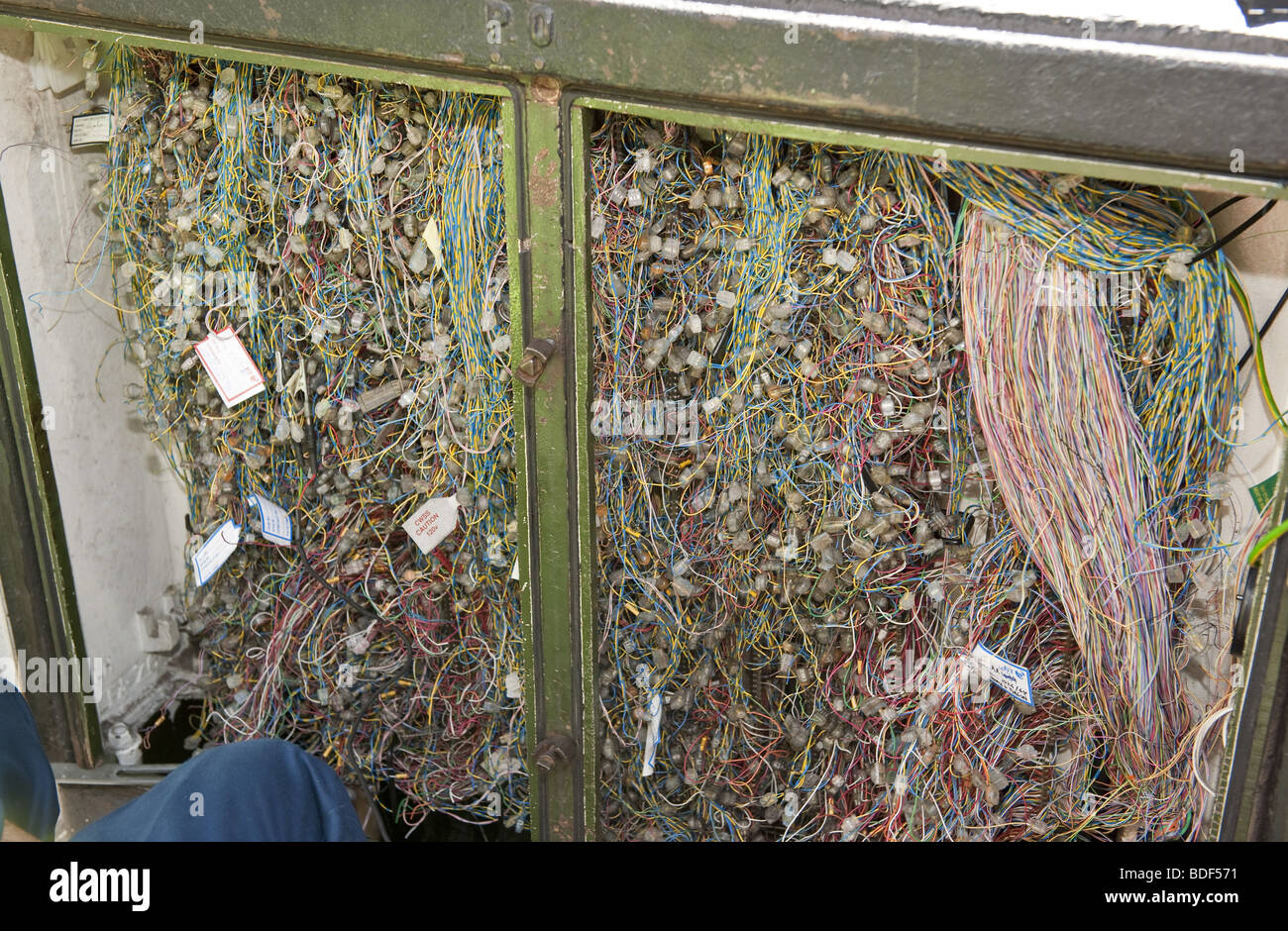 Looking into open BT telecommunications wiring junction box on street Stock Photo