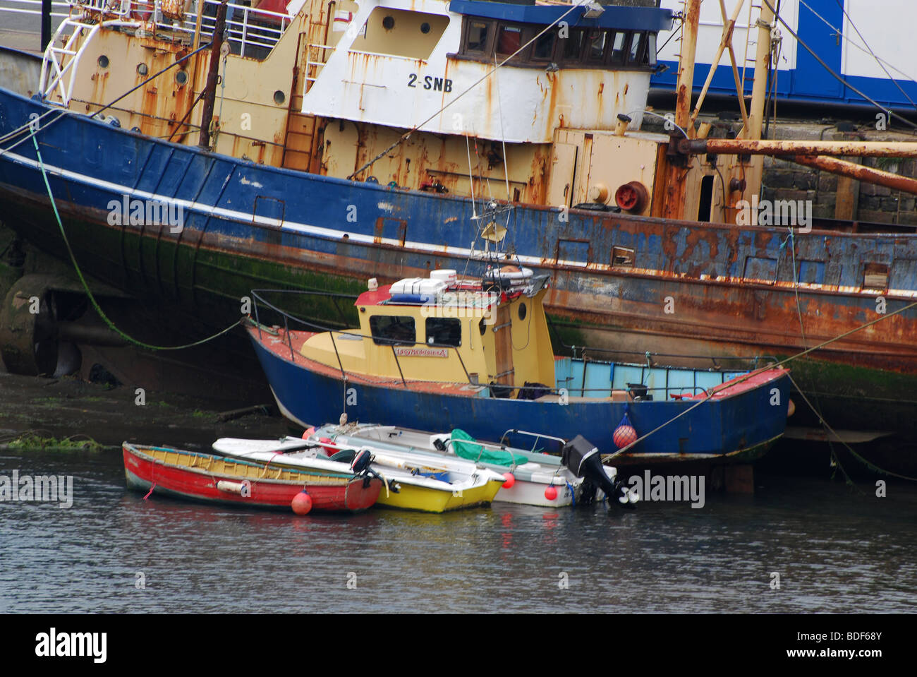 small to medium to large at brixham harbour number 2751 Stock Photo