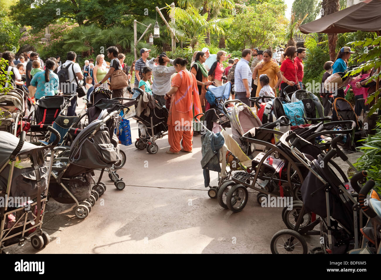 A crowded pram park and queue of mothers and children,  Disneyland, Paris France Stock Photo