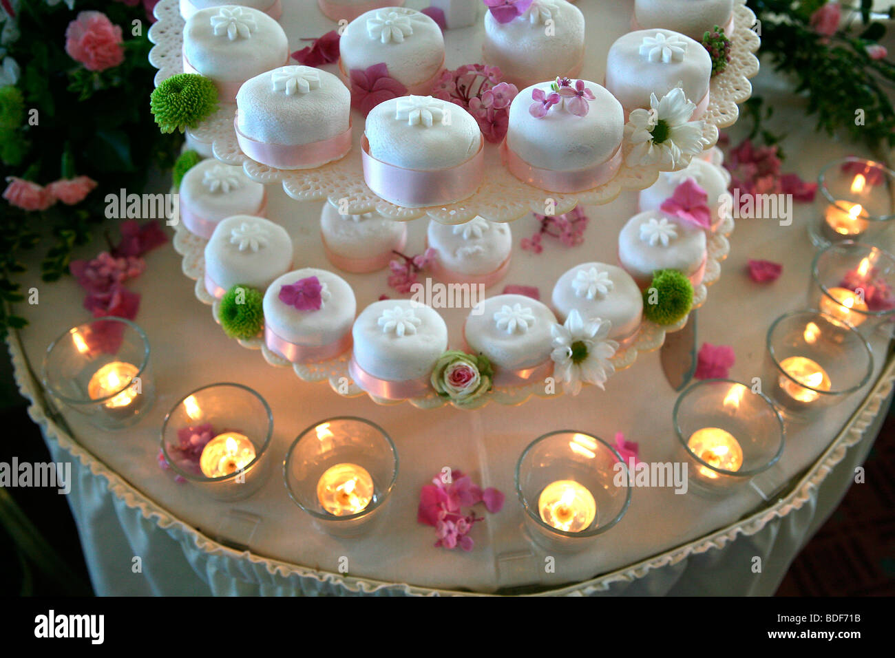 Pic by Mark Passmore.. 22/07/2006. Generic image of petite wedding cakes with candles. Stock Photo