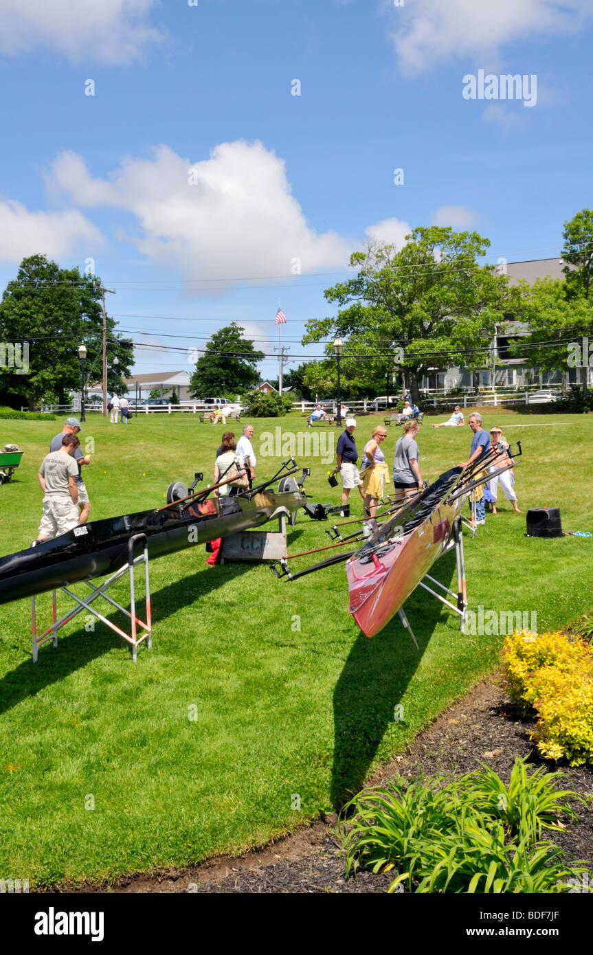 People looking at rowing shells display on land in Hyannis, Cape Cod Stock Photo