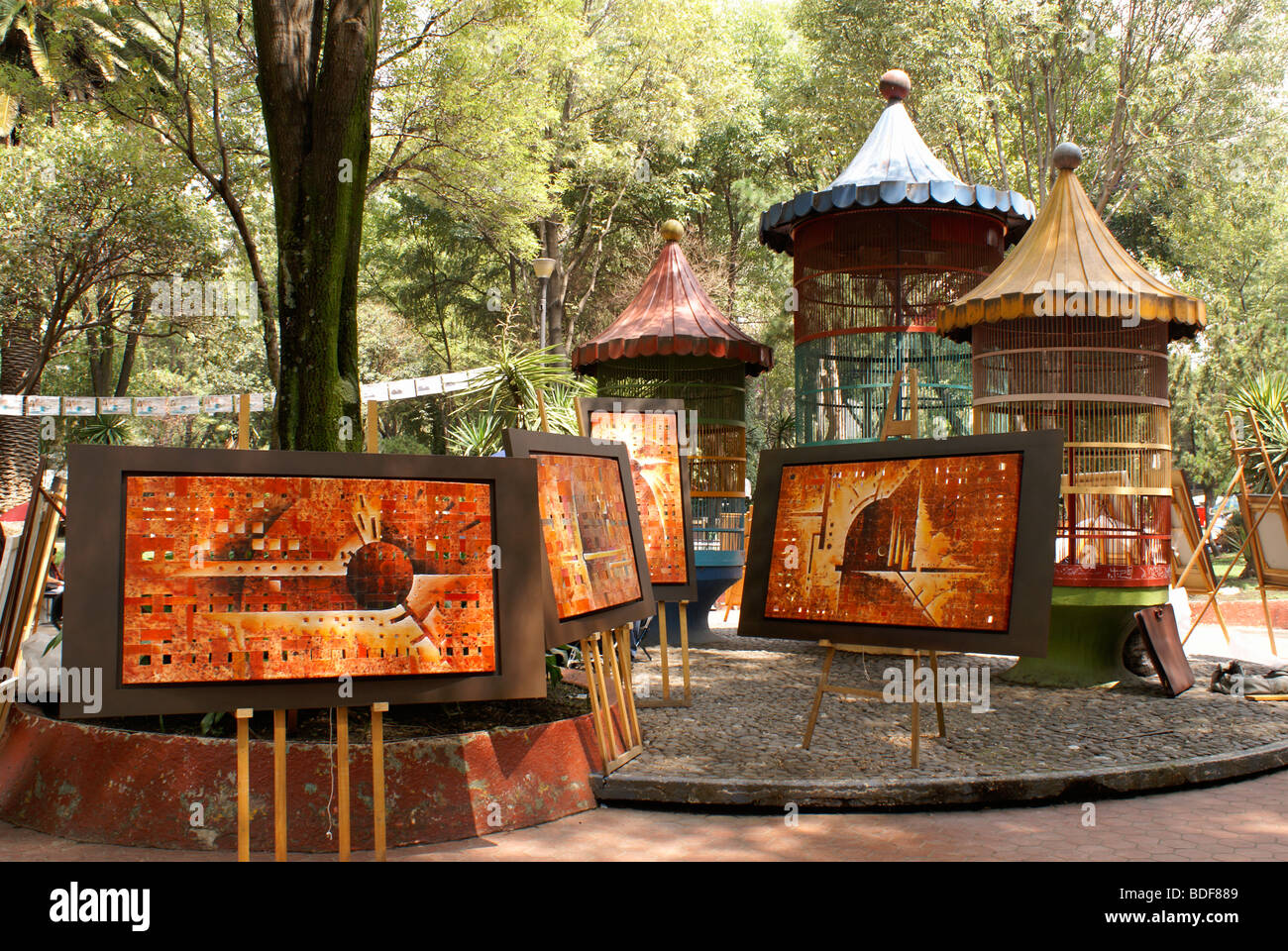 Paintings for sale at the at art show held every Sunday in the Jardin del Arte, Sullivan Park, Mexico City Stock Photo