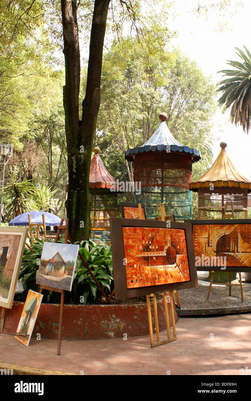 Paintings for sale at the at art show held every Sunday in the Jardin del Arte, Sullivan Park, Mexico City Stock Photo