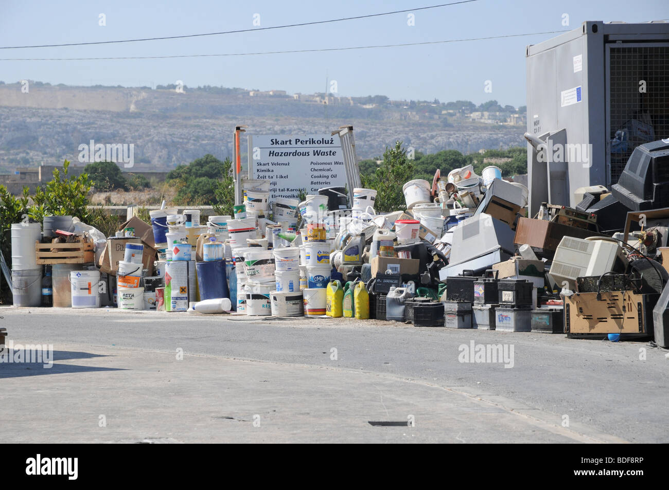 Paint buckets and fuel containers ready to be recycled at a waste management plant in Malta. Stock Photo