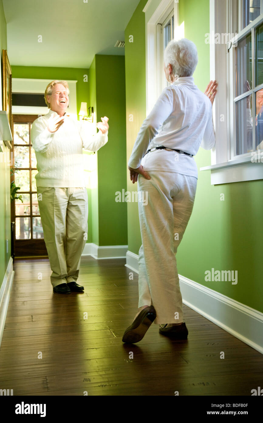 Happy senior couple in hallway of home Stock Photo - Alamy