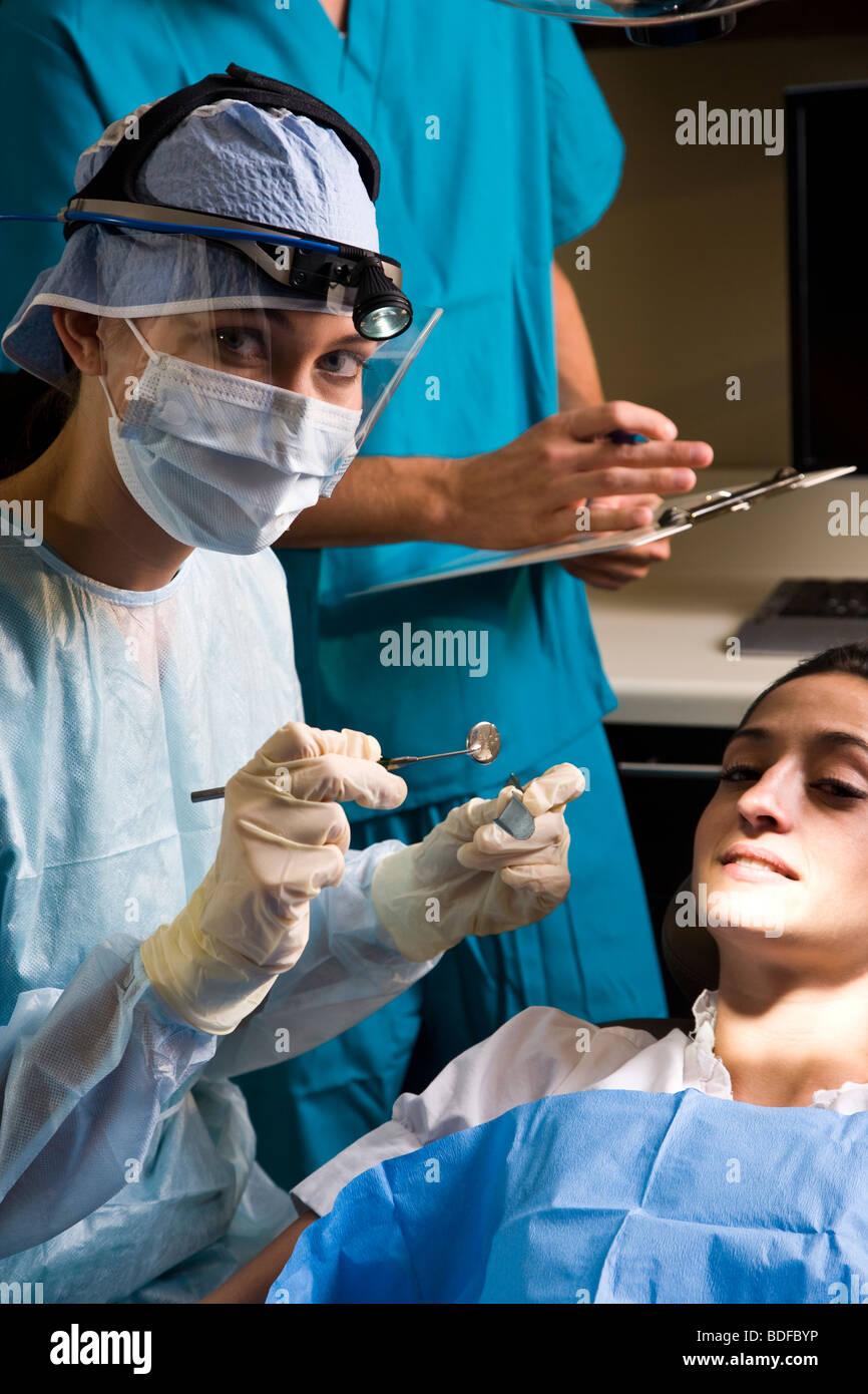 Portrait of dentist working on patient Stock Photo Alamy