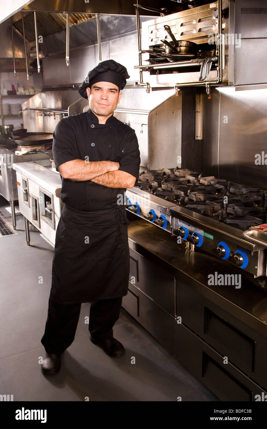 Professional chef standing in restaurant kitchen Stock Photo - Alamy