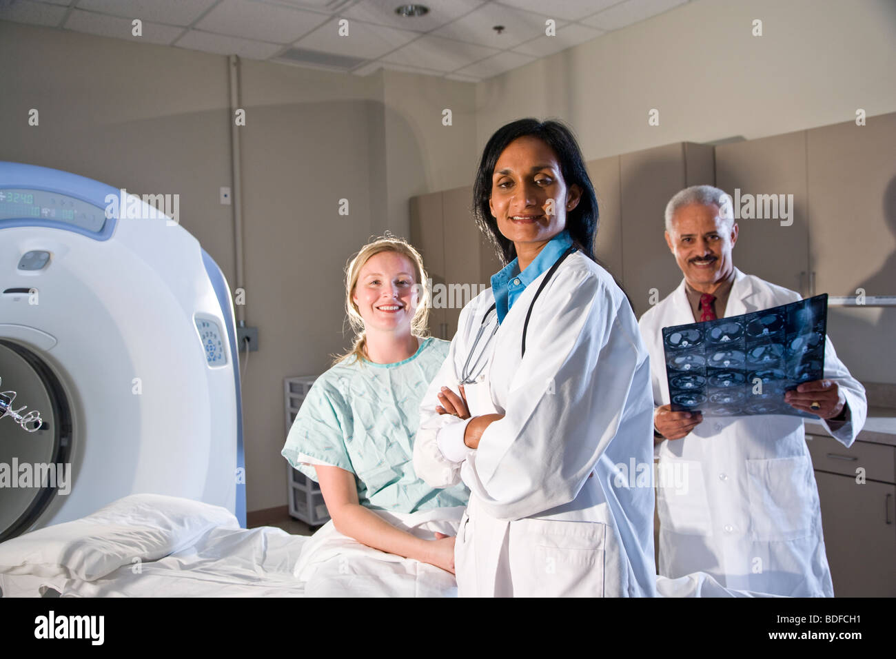 Pat Set Radiologist Radiologists and patient with results of CAT scan Stock Photo - Alamy