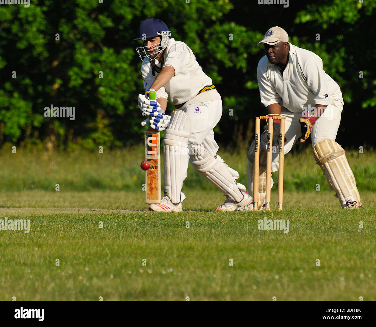Batsman hitting ball with defensive block Stock Photo Alamy