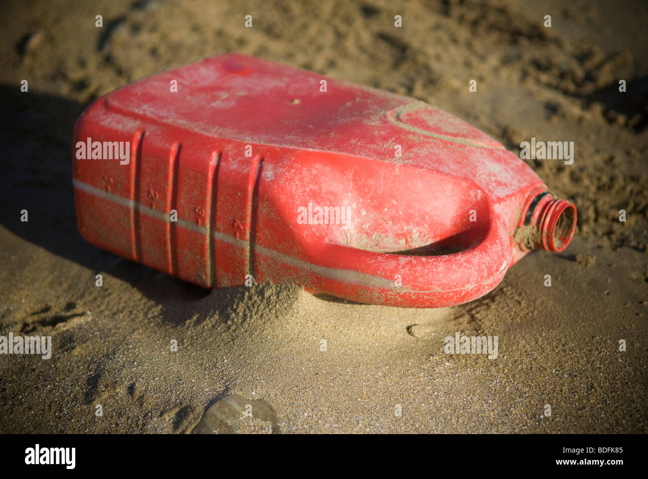 oil can on sand Stock Photo