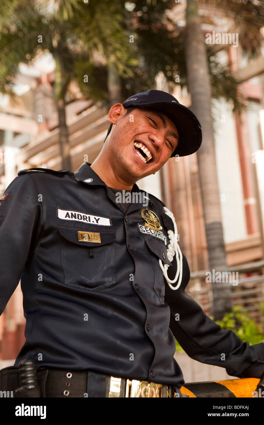 Indonesia, Java, Jakarta, Jalan Thamrin, Plaza Bll Menara office complex, laughing security guard Stock Photo