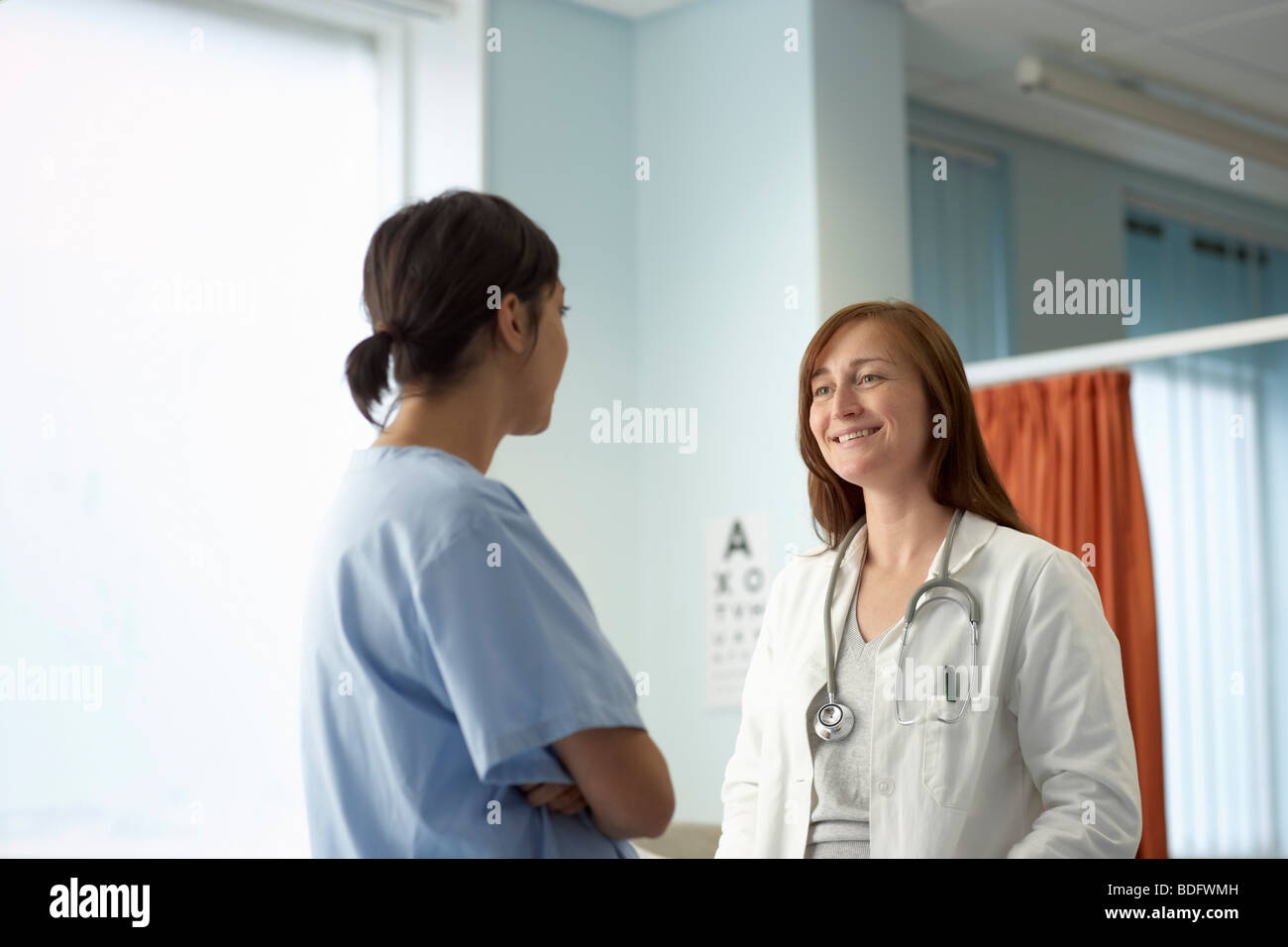 Nurse and doctor in discussion Stock Photo