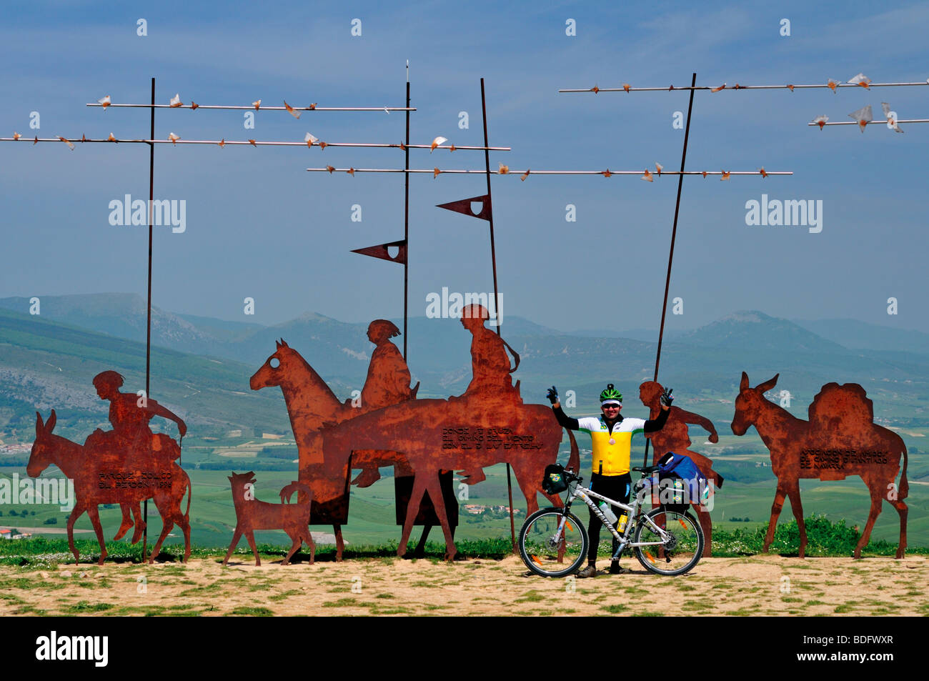 Spain, St. James Way: Bikers Pilgrim Thiago from Brazil at the pilgrim´s monument Alto del Perdon in Navarra Stock Photo