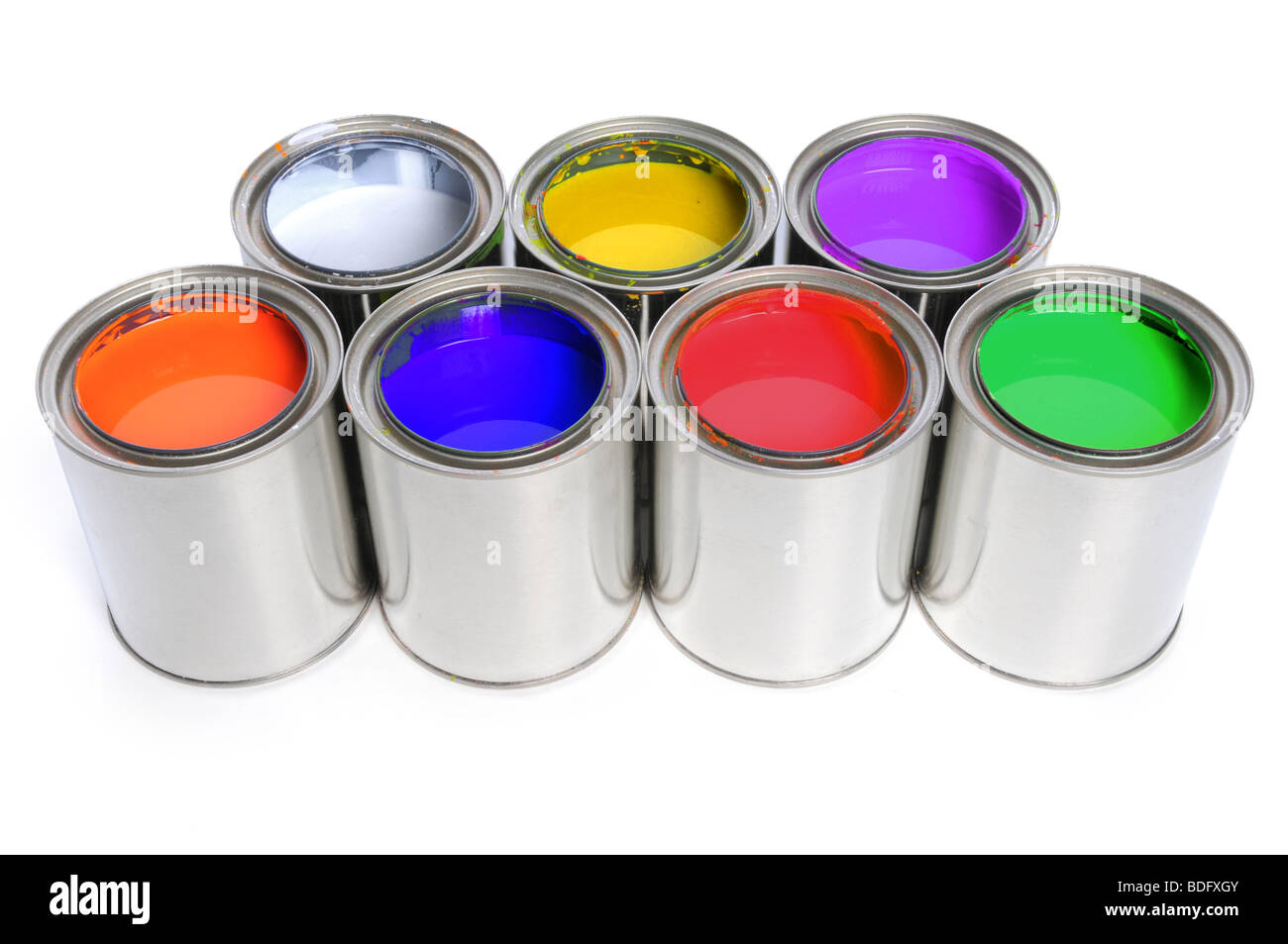 Seven open cans of paint with primary and secondary colors and white Stock Photo