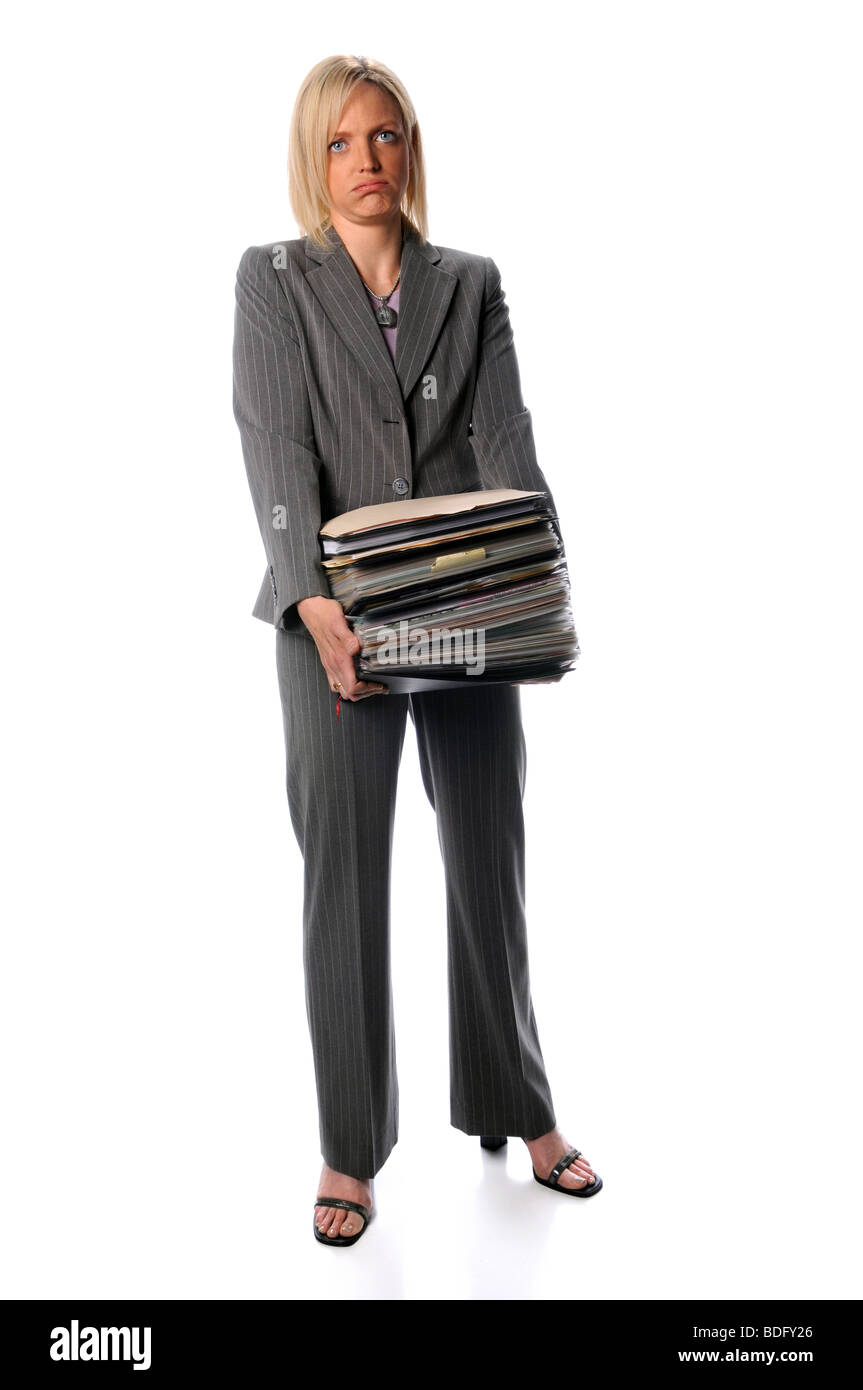 Attractive businesswoman holding stack of paperwork isolated over white Stock Photo