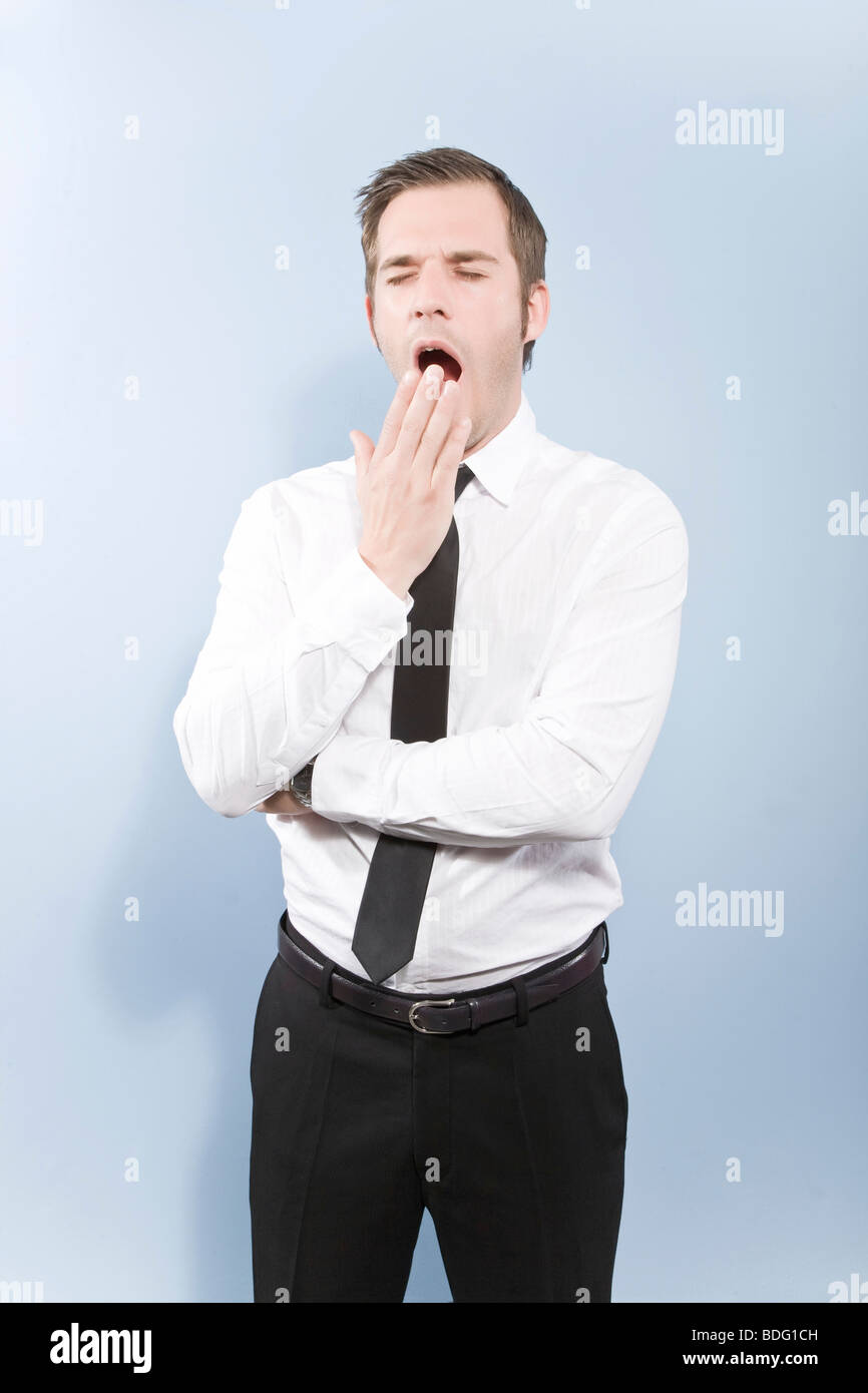 Businessman yawning Stock Photo