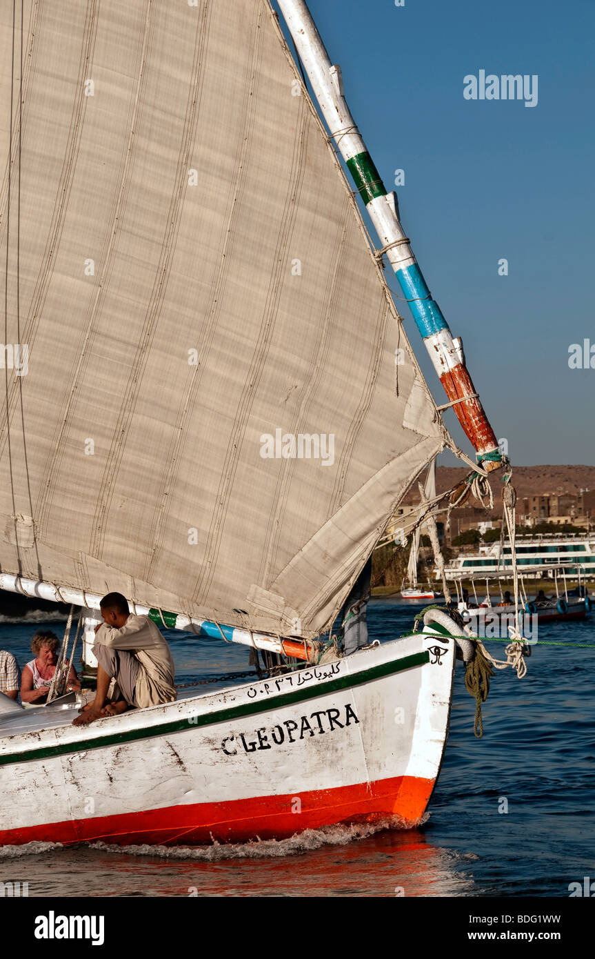 Felucca traditional wooden sailboat portrait on Nile River Aswan Egypt profile lateen sail Stock Photo