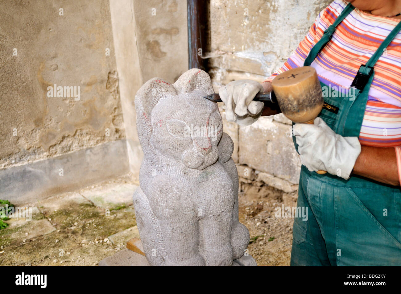 Sculptor working on a stone Stock Photo Alamy