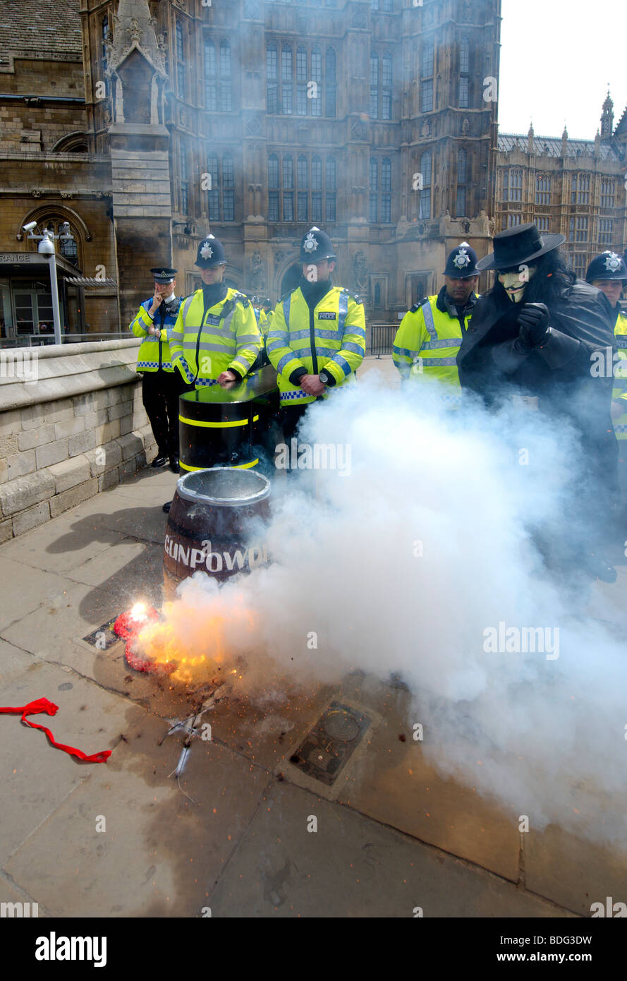 Demonstrator dressed as Guy Fawkes outside Parliament with a barrel of gunpowder protesting against MPs and their expenses Stock Photo