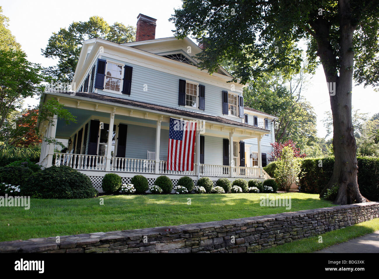 Large house with a flag on the porch, Sag Harbor, Long Island, New York Stock Photo