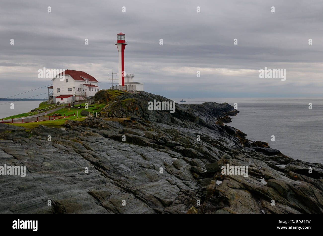 Cape Forchu lighthouse on the Atlantic Ocean the morning after a rain storm  near Yarmouth Nova Scotia Stock Photo - Alamy
