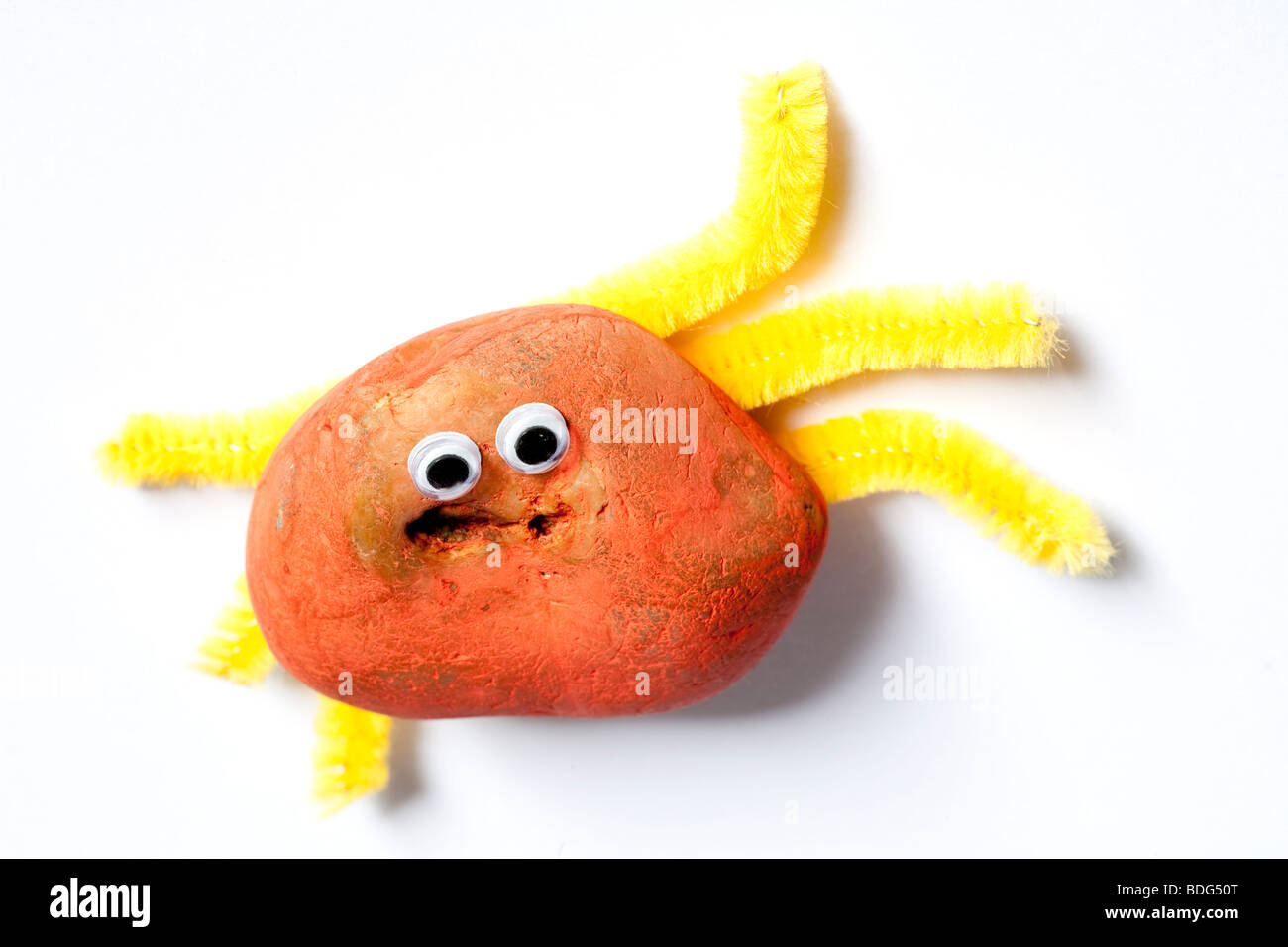 Toy bug made from a stone Stock Photo