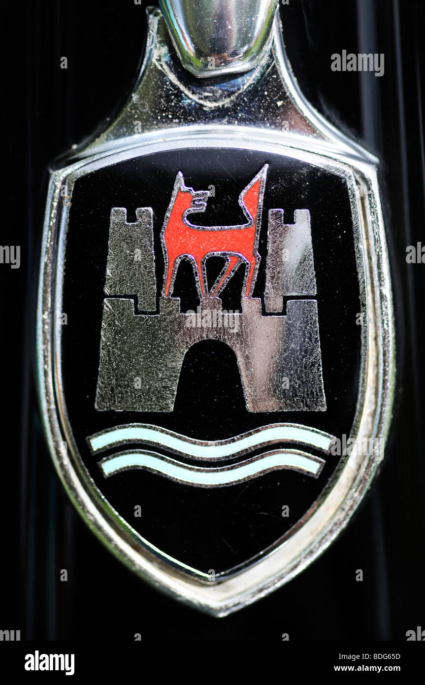 Wolfsburg's coat of arms, logo of the Volkswagen plants in Wolfsburg, on an old VW Beetle, Germany Stock Photo