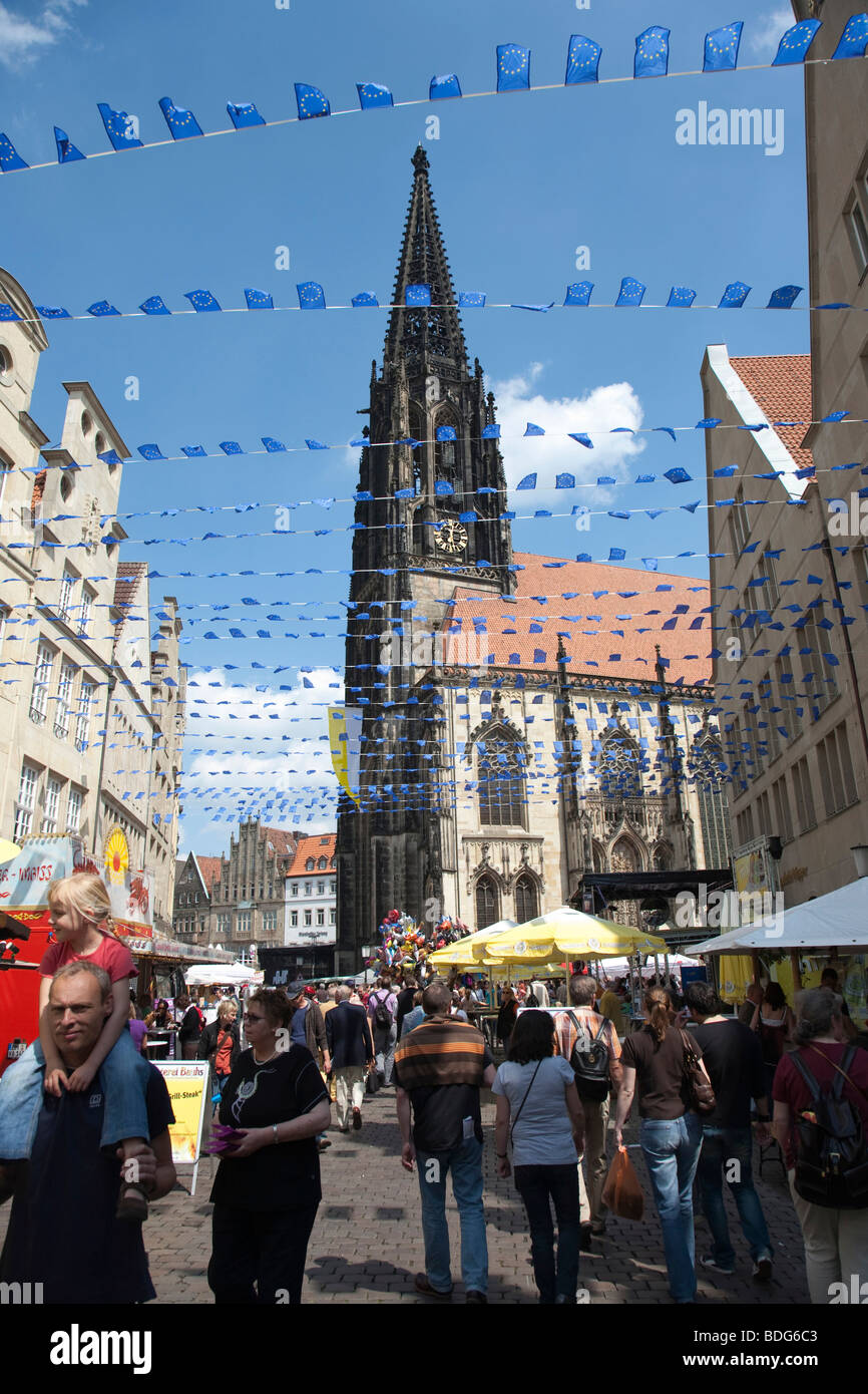 Europe Day in Muenster, gabled houses on the Prinzipalmarkt square, St. Lamberti Kirche church, North Rhine-Westphalia, Germany Stock Photo