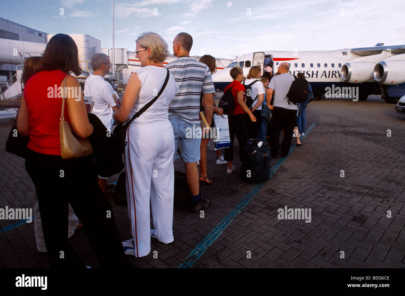 Gatwick Airport England Passengers Queuing waiting To Board Aeroplane Stock Photo