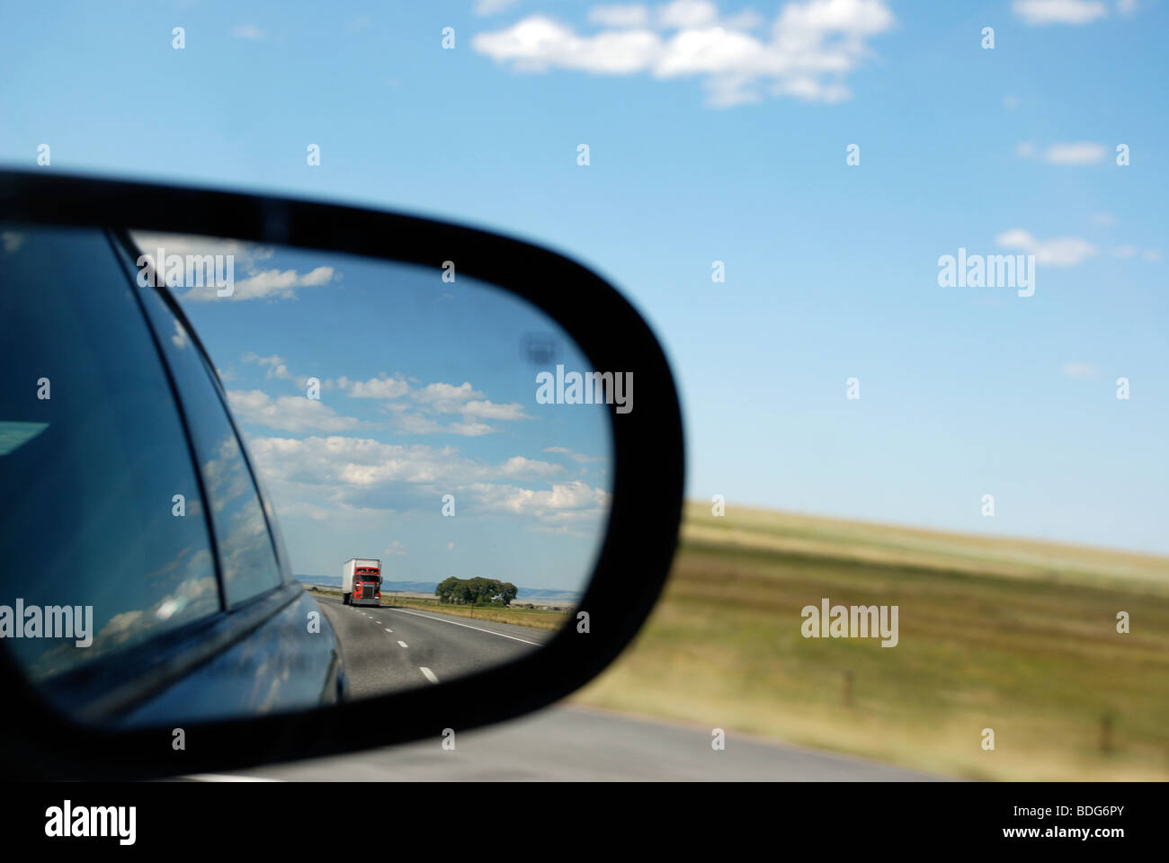 Truck in rear view mirror Stock Photo - Alamy