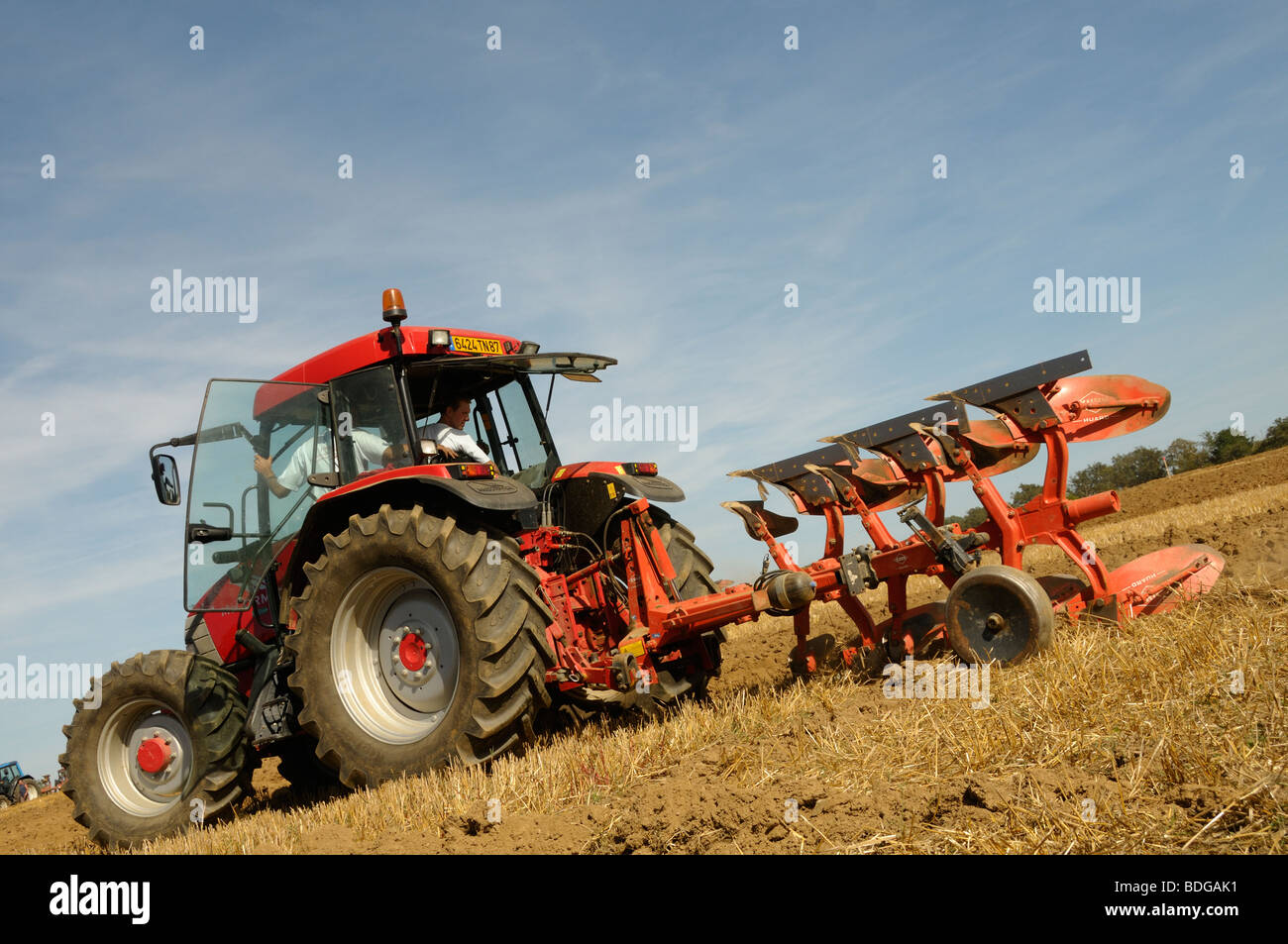 Stock photo of tractors ploughing fields in a farming competition in ...