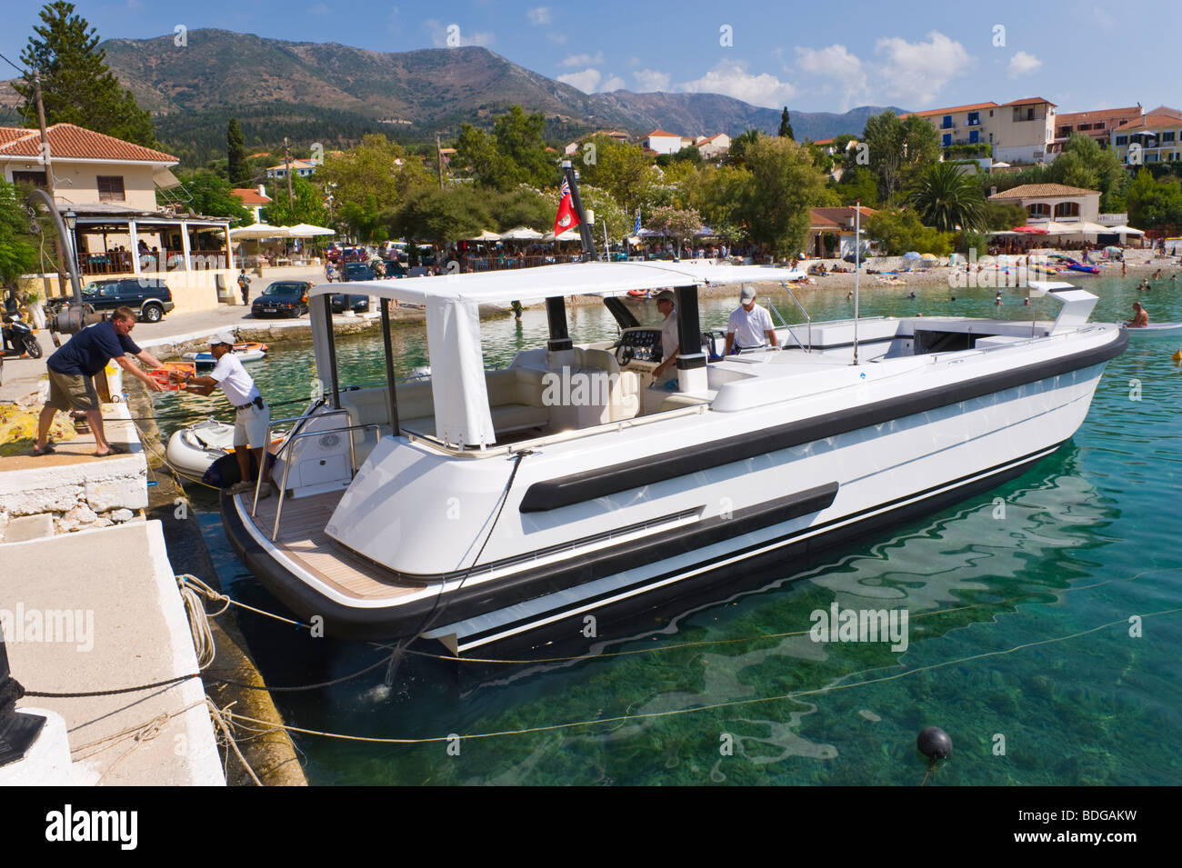 Tender for luxury super yacht Rising Sun taking on supplies at Assos on