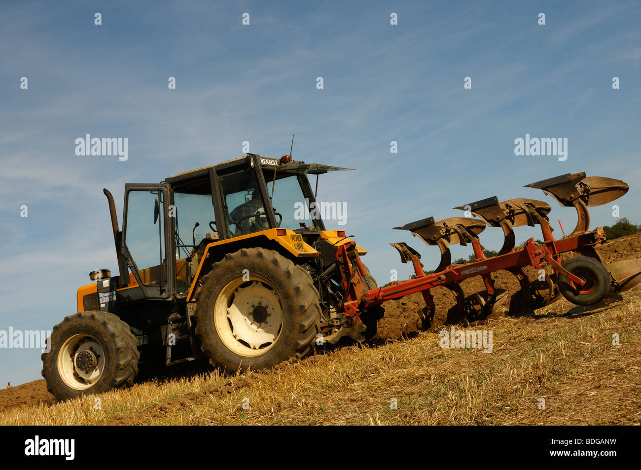 Stock photo of tractors ploughing fields in a farming competition in