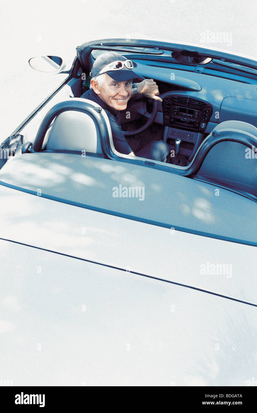 Man in his convertible Stock Photo