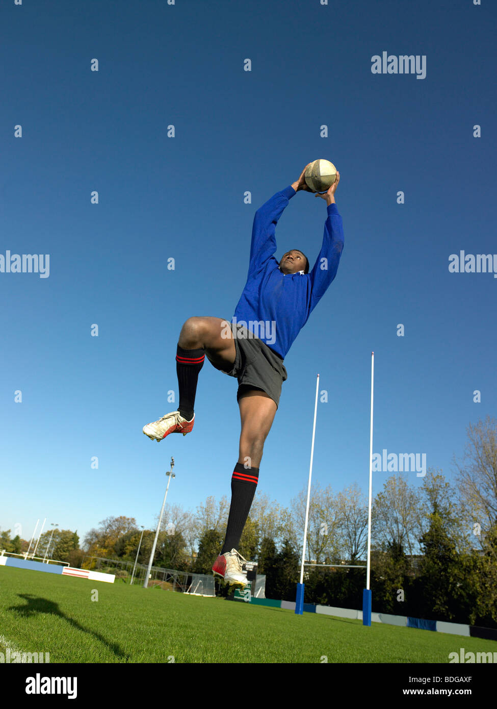 Rugby player catching ball Stock Photo Alamy
