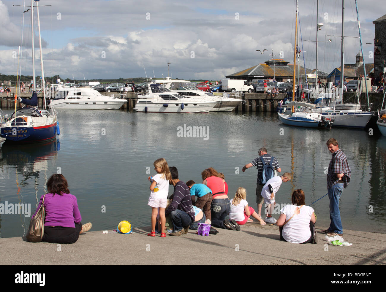 Families crab fishing at Padstow Harbour, Padstow, North Cornwall