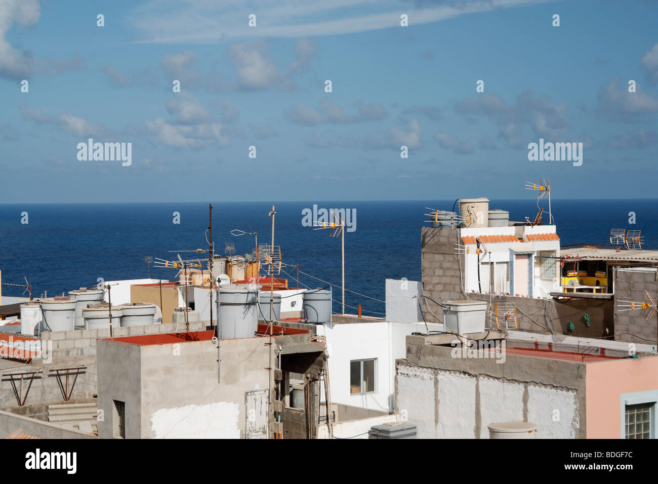 View over rooftops of houses in coastal village in Spain Stock Photo