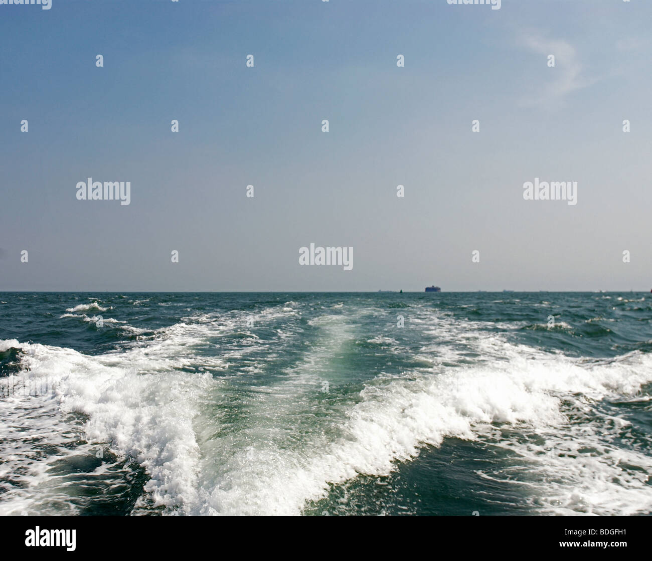 wake in the sea behind a boat Stock Photo