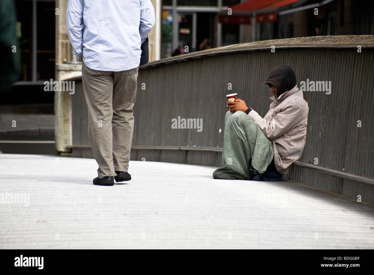 A beggar on the Millennium Bridge over the River Liffey,  Dublin, Republic of Ireland Stock Photo
