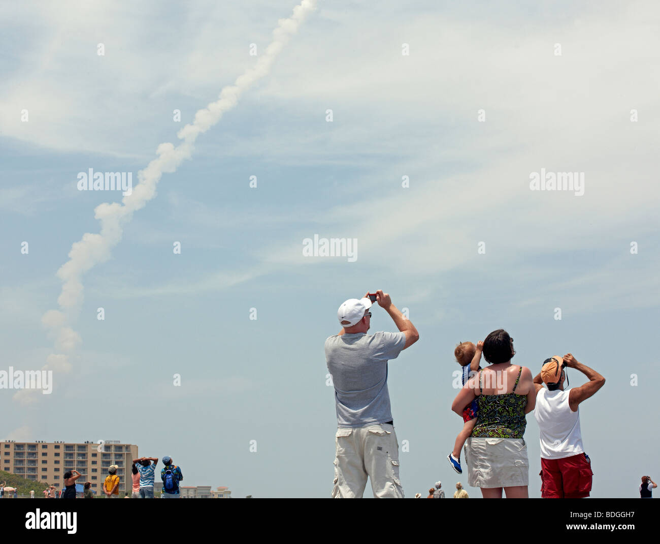 trail of smoke from the space shuttle Atlantis shot from Cape Canaveral beach Florida Stock Photo