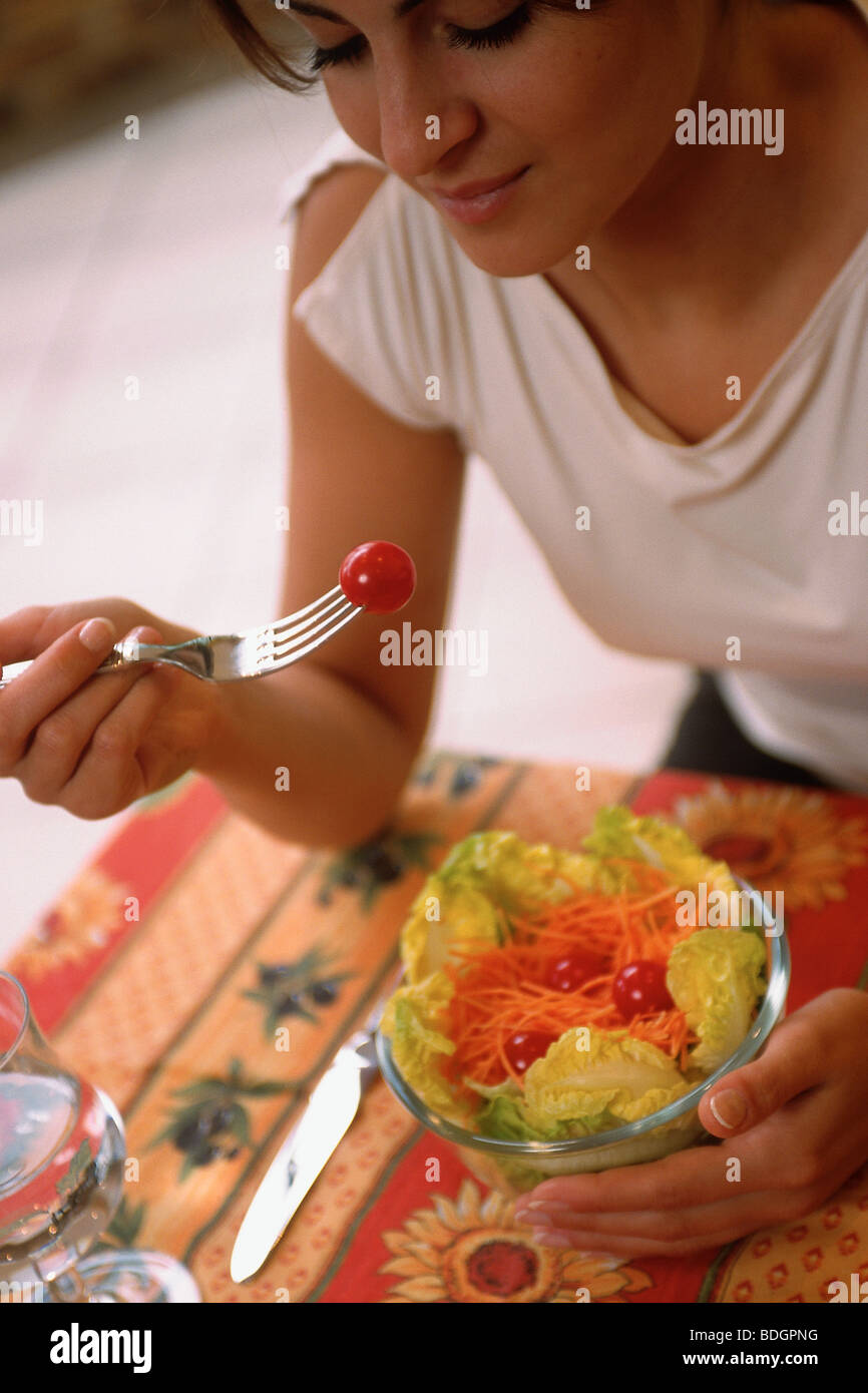 WOMAN EATING RAW VEGETABLES Stock Photo Alamy