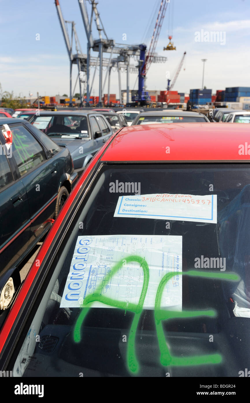 Germany Hamburg , used old cars await export to africa Cotonou Benin at