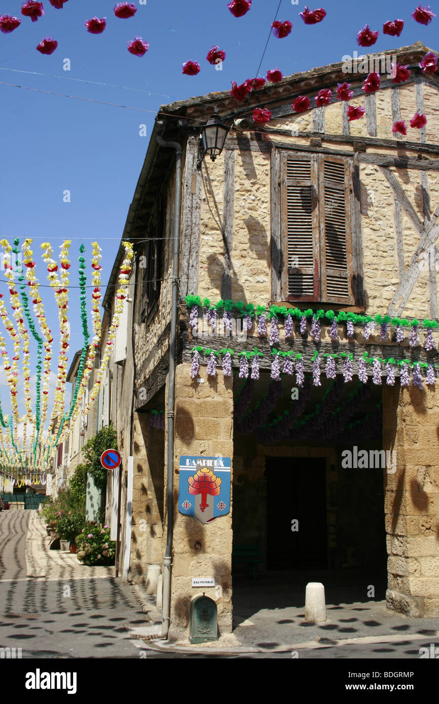 Town of Beaumont du Perigord festooned with flowers during the summer Felibree Stock Photo
