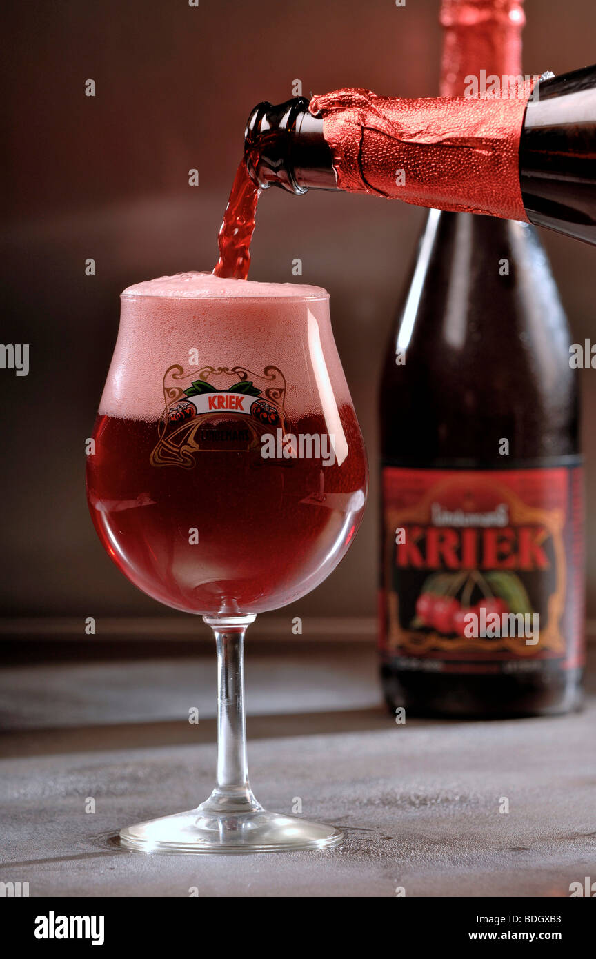 Pouring glass of Kriek Belgian fruit beer Stock Photo Alamy