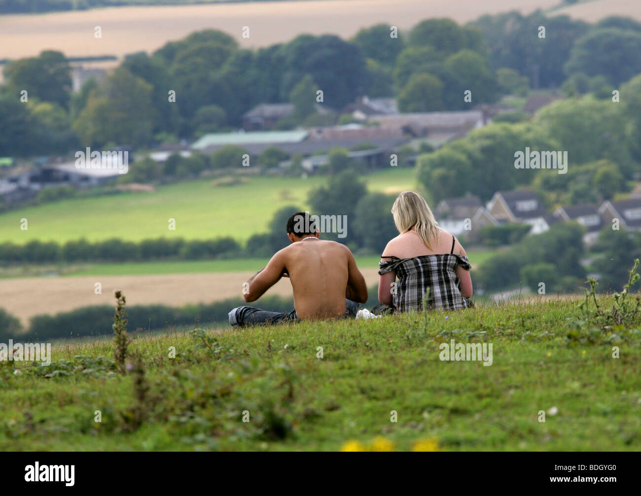 Young couple sitting relaxing on grass hi-res stock photography and ...