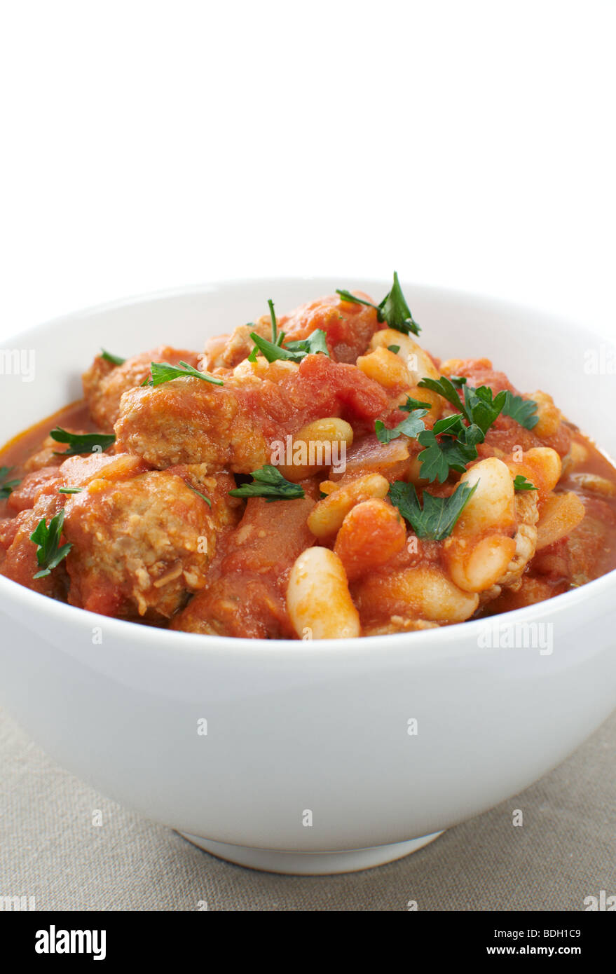 Duck and pork sausage cassoulet, with cannellini and flageolet beans garnished with parsley Stock Photo