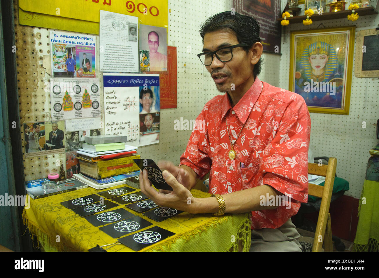 fortune teller in Bangkok Thailand giving a tarot card reading Stock