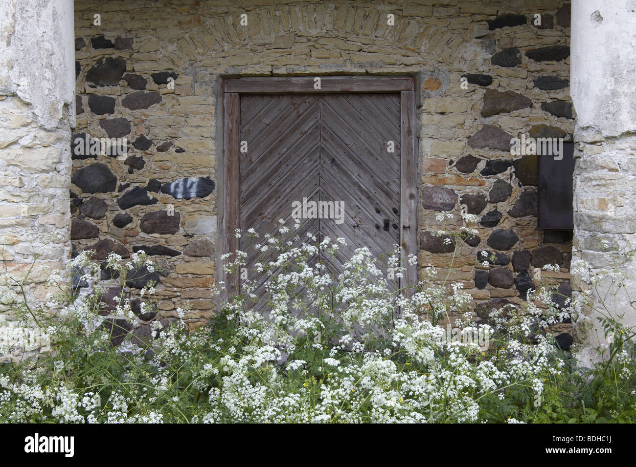 Old stone building with wooden door Stock Photo