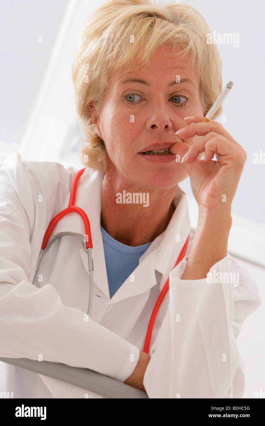 Overworked tired female doctor sits hi-res stock photography and images ...