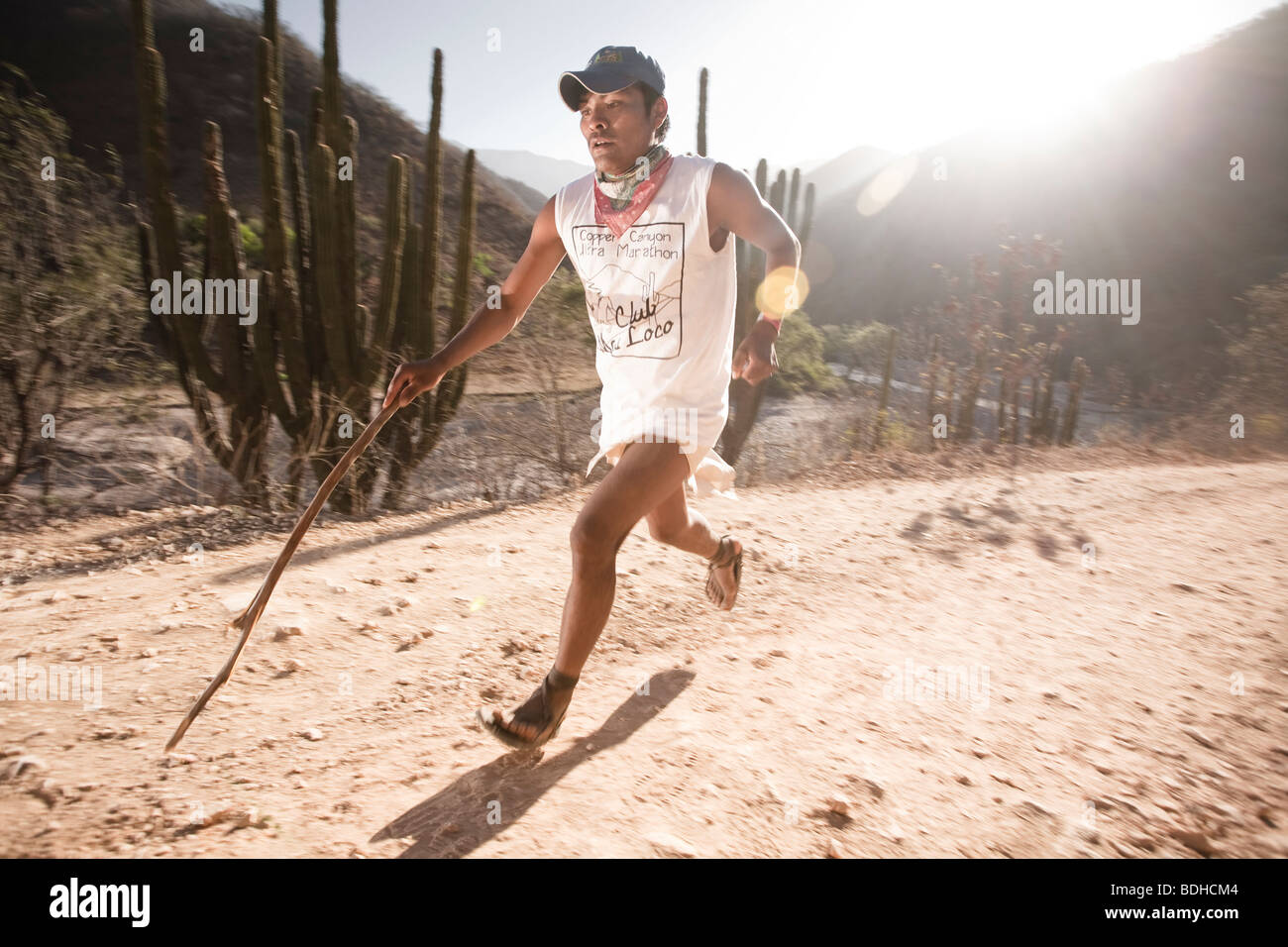 A Tarahumara Runner Running With A Stick As A Pole During An Ultra Stock Photo Alamy
